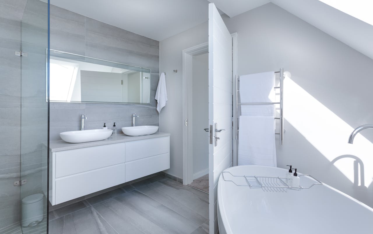 project-03-d Sleek contemporary bathroom with bathtub and twin sinks, showcasing minimalist design and luxury.
